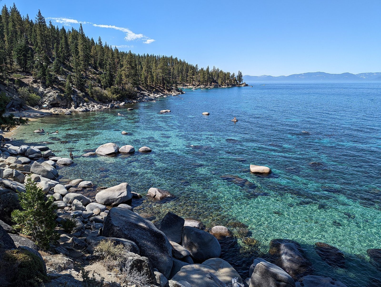 Granite boulders and clear turquoise water at Thunderbird Cove